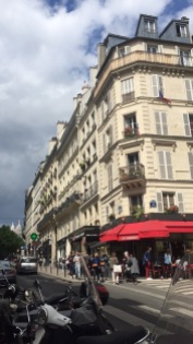 Rue des Martyrs with a slice of Sacre-Cœur